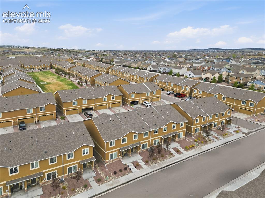 Image 38 of 44: Aerial perspective showcasing a community of multi-story residences with at