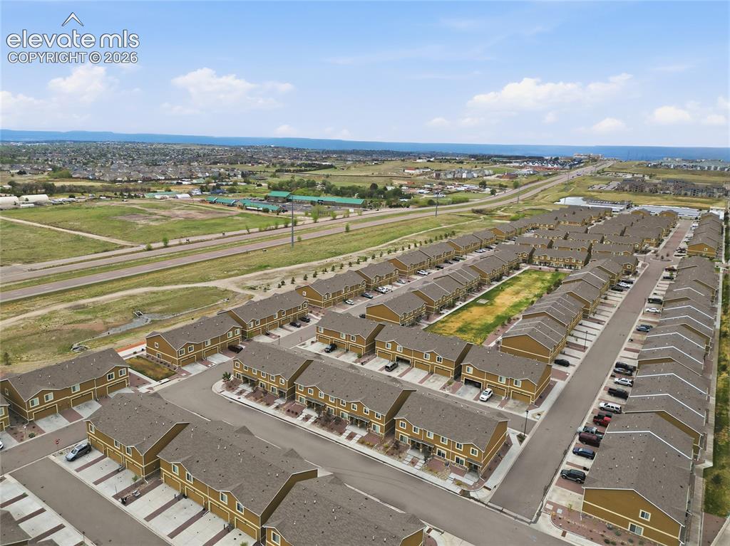 Image 42 of 44: Aerial perspective of a multi-unit residential community featuring uniform 