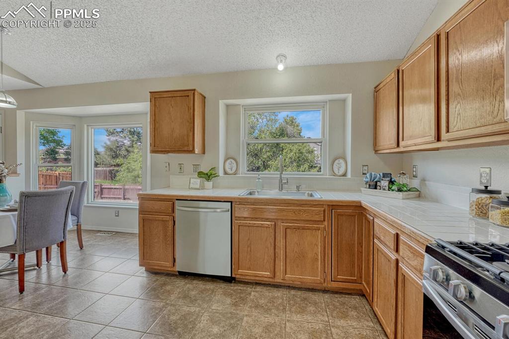 Image 10 of 40: The Kitchen flows into the Dining Area making it easy for food service and 