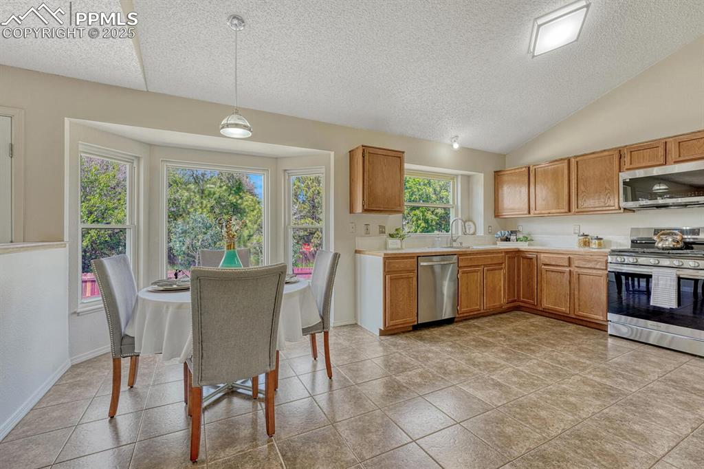 Image 11 of 40: Kitchen and Dining Area.