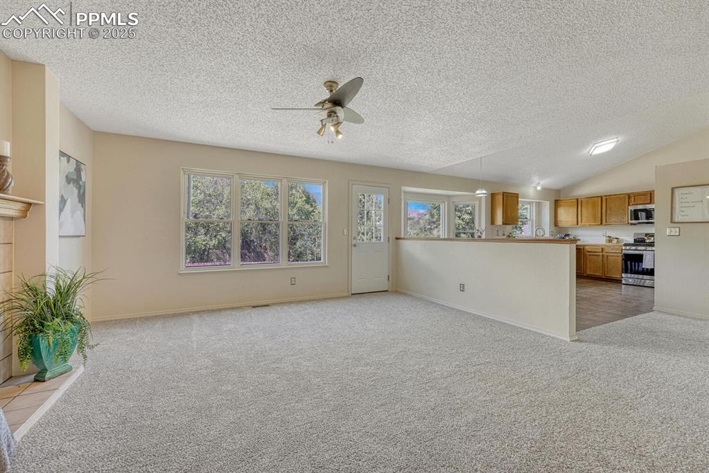 Image 15 of 40: The Family Room walks out to a backyard patio.
