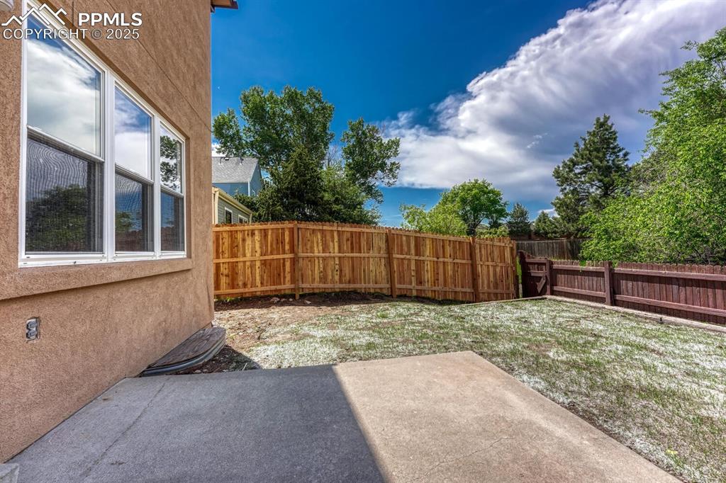 Image 16 of 40: Enjoy outdoor dining and relaxation on the backyard patio.
