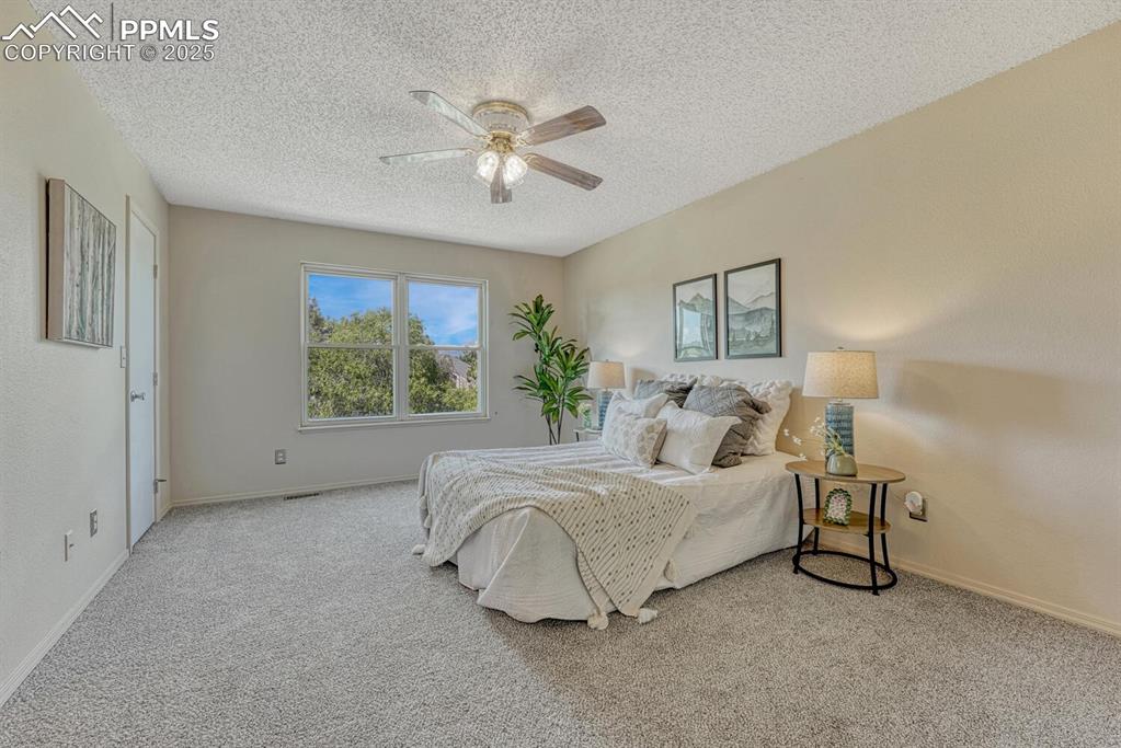 Image 21 of 40: Upstairs, the private Primary Bedroom Suite offers a walk-in closet & Full 