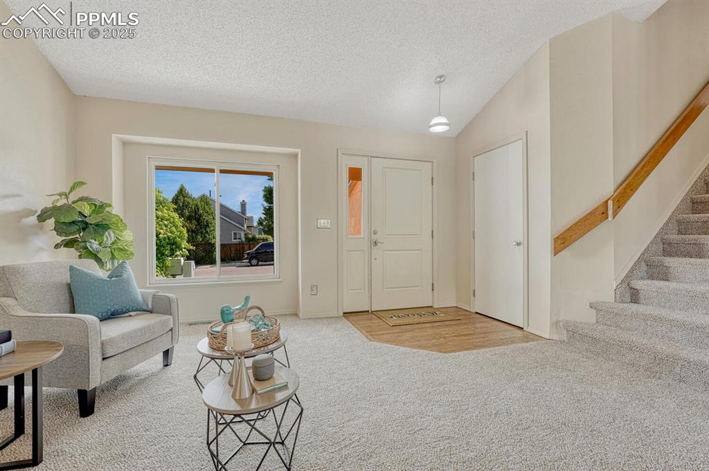 Image 3 of 40: Wood Entry with coat closet.