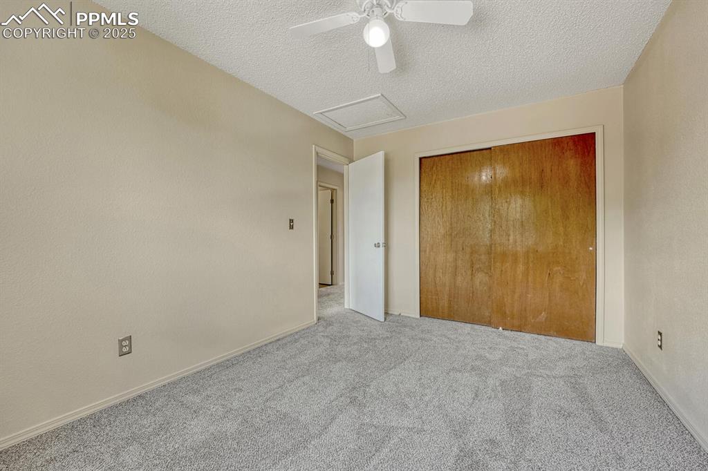 Image 30 of 40: Upper Level Bedroom #3 with generous closet.