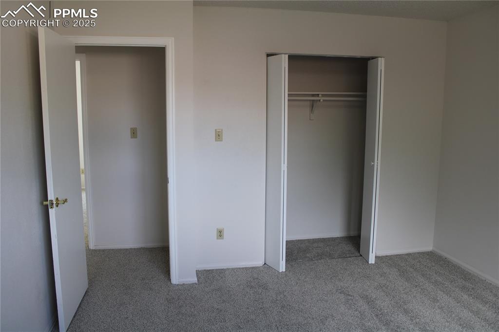 Image 20 of 35: Unfurnished bedroom with light carpet and a closet