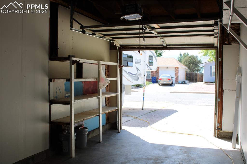 Image 28 of 35: Garage with a garage door opener