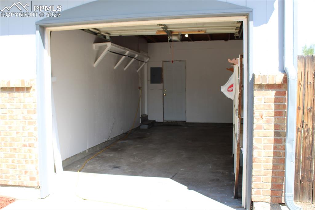 Image 29 of 35: Garage featuring electric panel