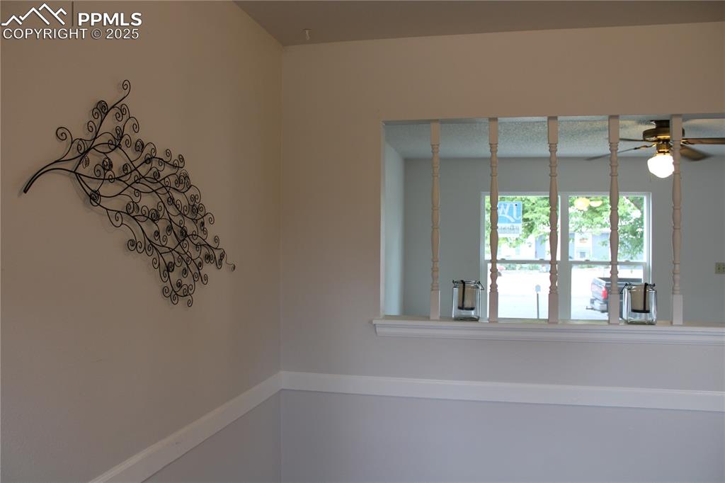 Image 7 of 35: Looking from kitchen into living area-space for table and chairs