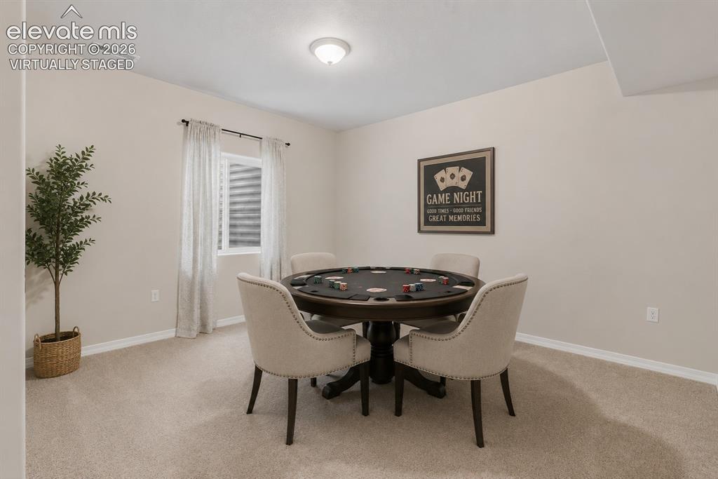 Image 31 of 49: Game / dining, and or bonus space near wet bar - - virtually staged