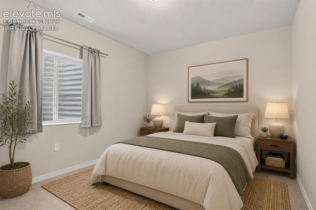 Image 33 of 49: Neutral tone walls with white trim and carpeted flooring - - virtually sta