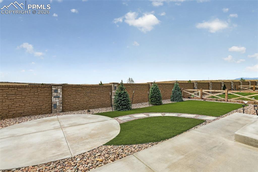 Image 39 of 44: Single-story residence featuring a contemporary exterior with light-colored