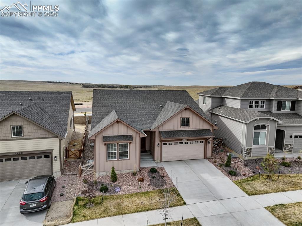 Image 42 of 44: Contemporary ranch-style home featuring a two-car garage, covered entry, an