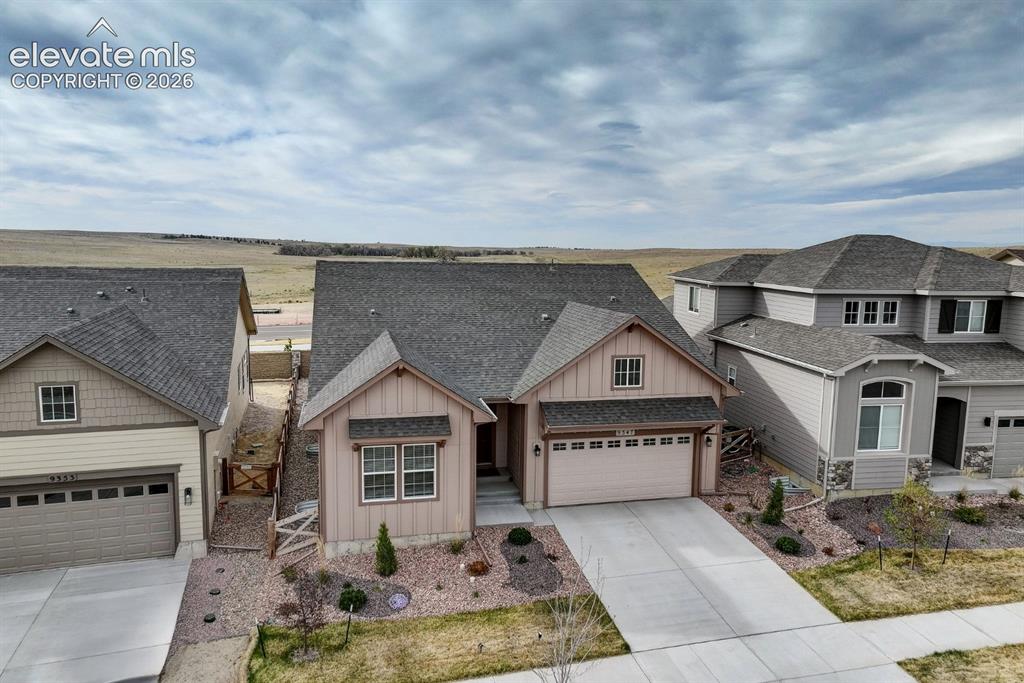 Image 48 of 49: Contemporary ranch-style residence featuring vertical and horizontal siding