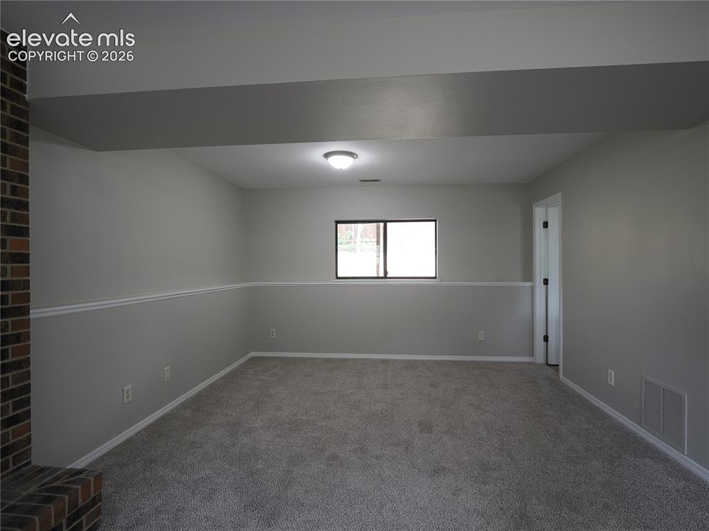 Image 23 of 31: extra room off living room
