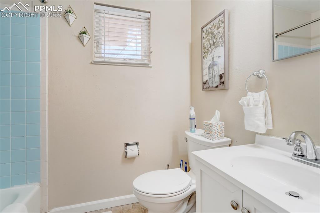 Image 14 of 25: Bathroom featuring vanity and bathtub / shower combination