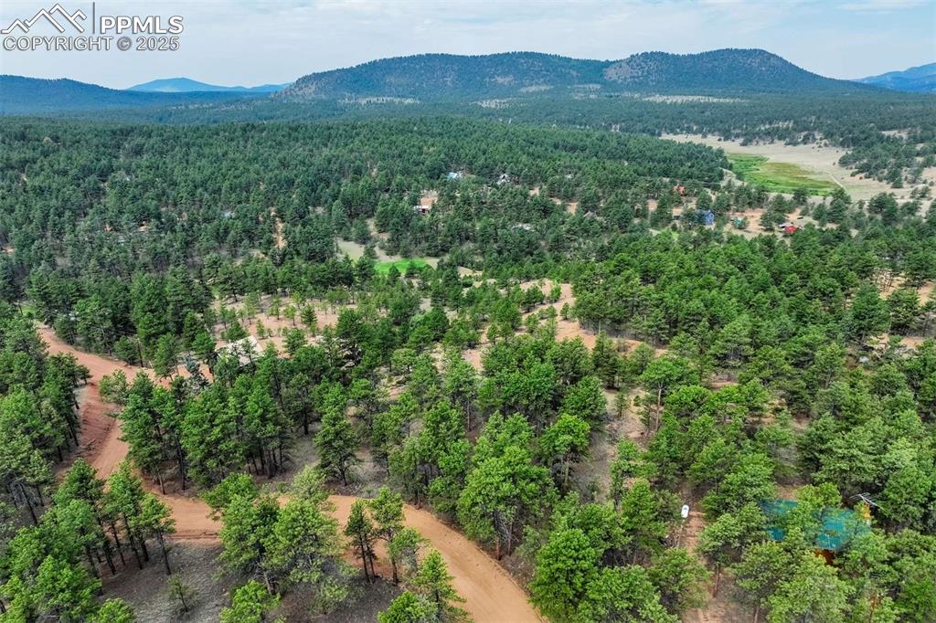 Image 2 of 25: Drone / aerial view of mountains from the property.