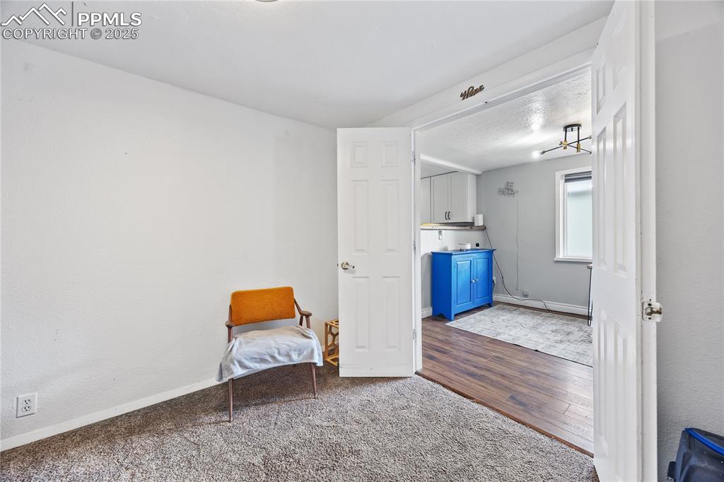 Image 19 of 36: Unfurnished room with wood finished floors and baseboards
