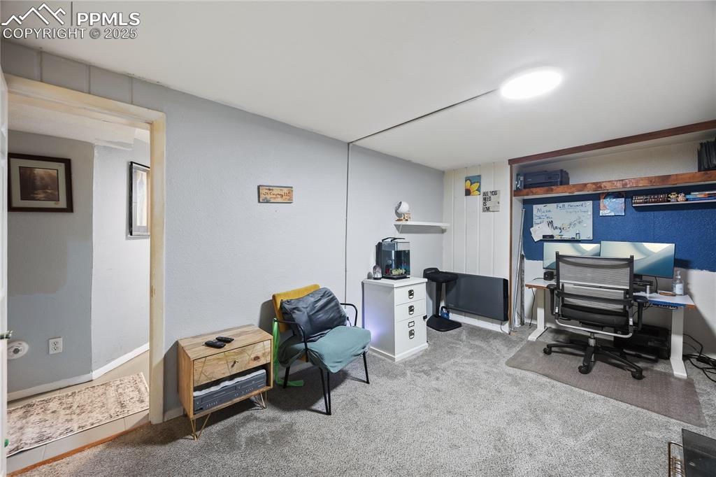 Image 24 of 36: Office space with carpet flooring