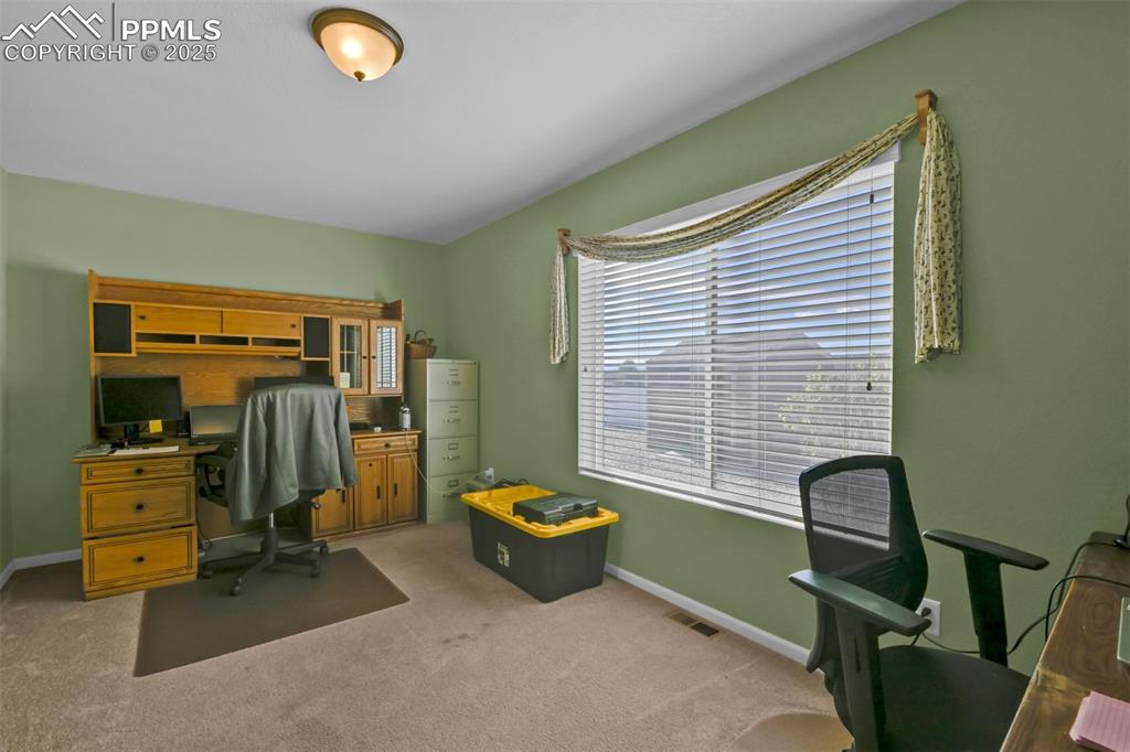 Image 17 of 50:  Carpeted Office on Main Level