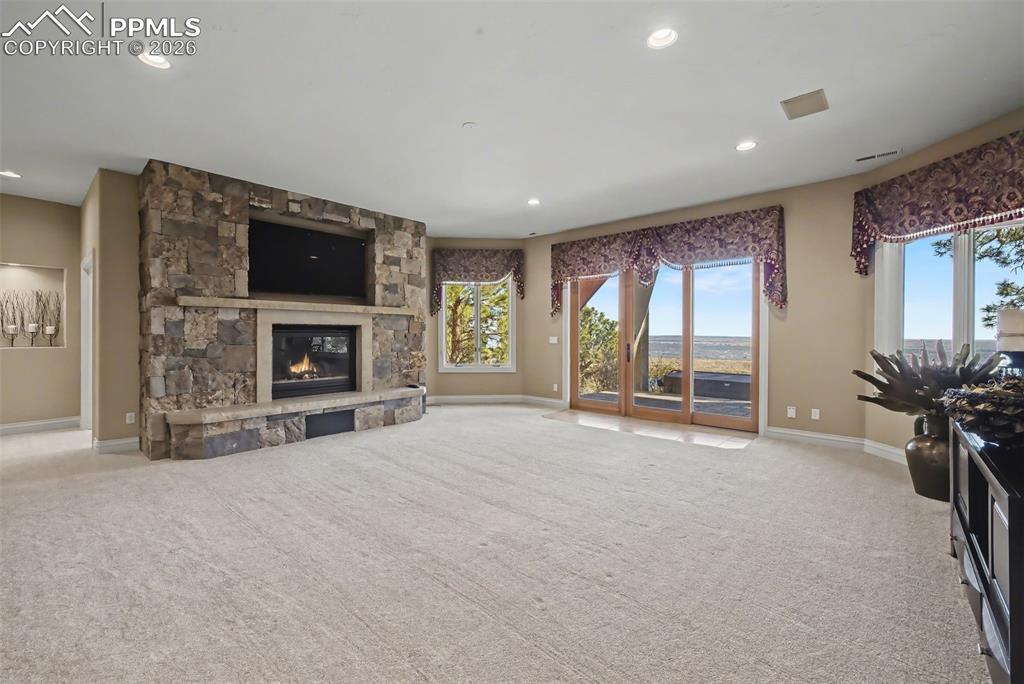 Image 33 of 50: Floor to ceiling stone fireplace