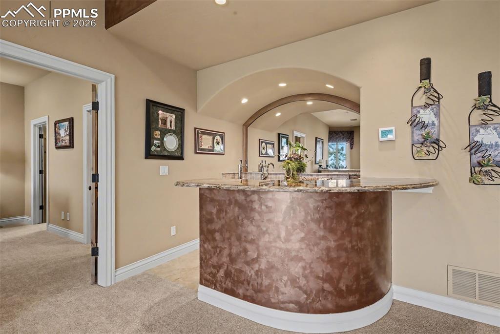 Image 36 of 50: Family Room wet bar