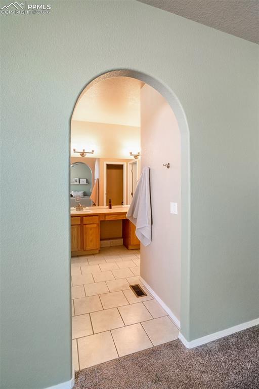 Image 15 of 26: 5-piece primary bath with access to large walk-in closet