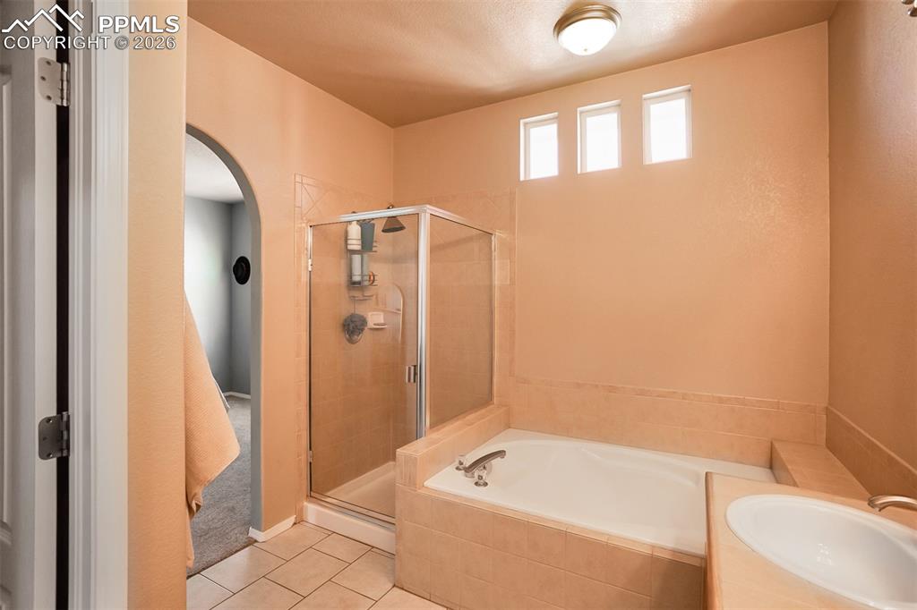 Image 17 of 26: Shower and soaking tub in Primary Bath