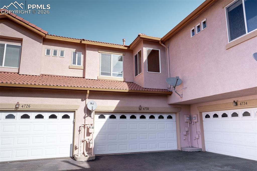 Image 24 of 26: Middle of the 3 doors is the homes garage