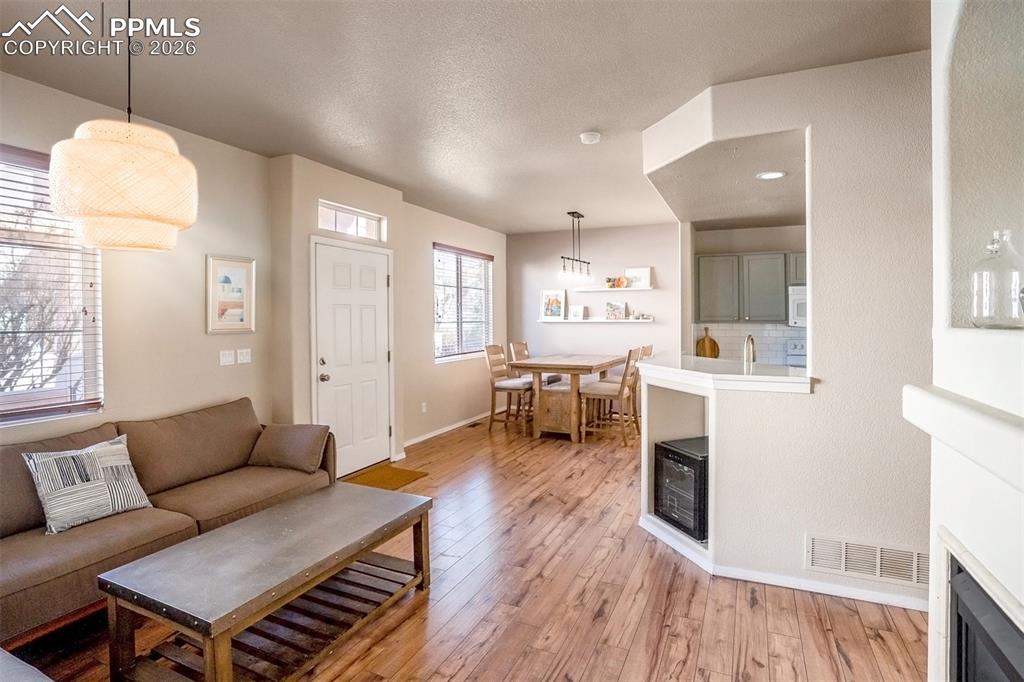 Image 3 of 26: Living Room, Entry and Dining Room