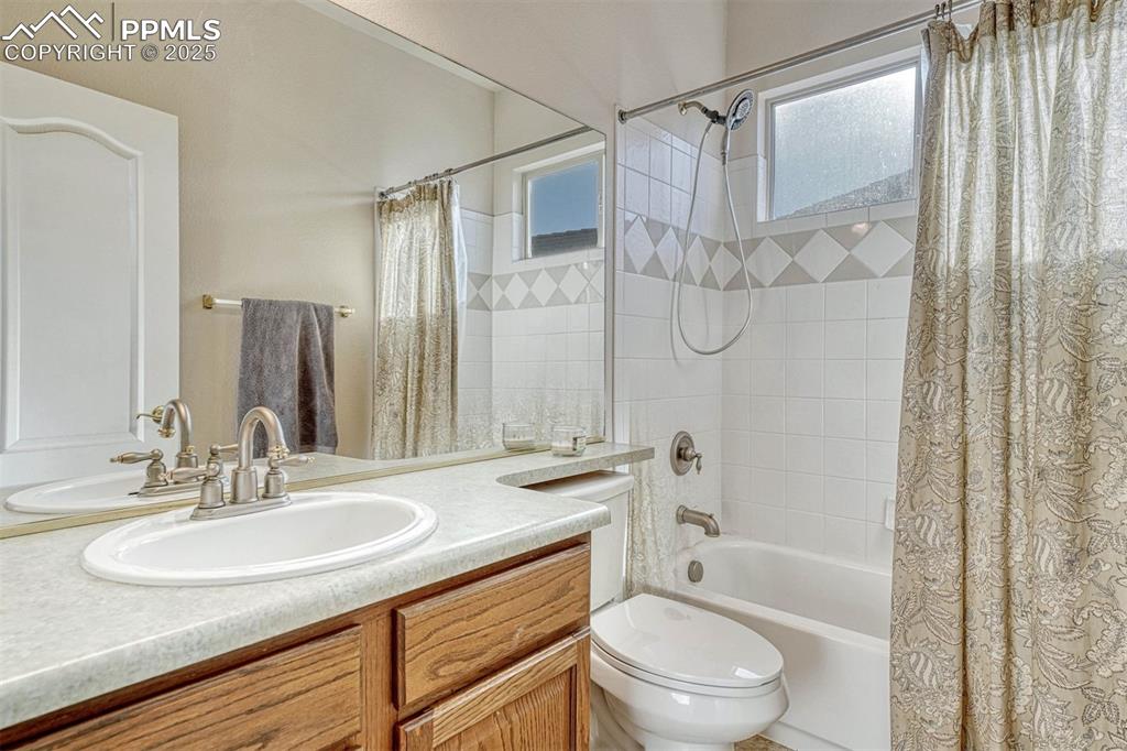 Image 14 of 35: Bedroom with hardwood / wood-style flooring and ceiling fan