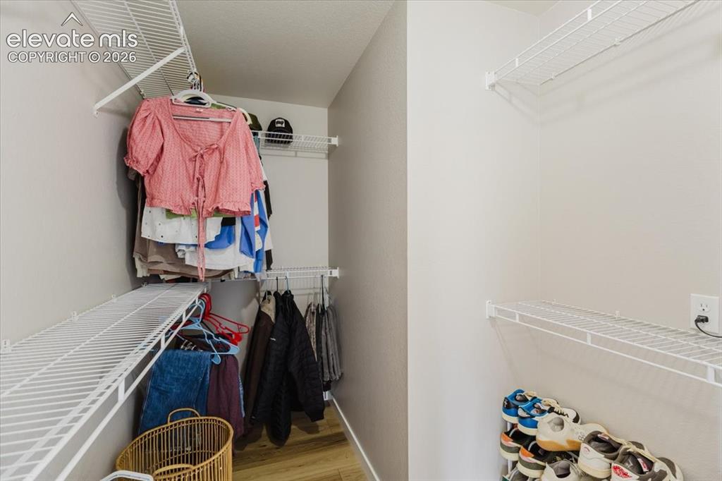 Image 15 of 38: walk in closet in primary bedroom