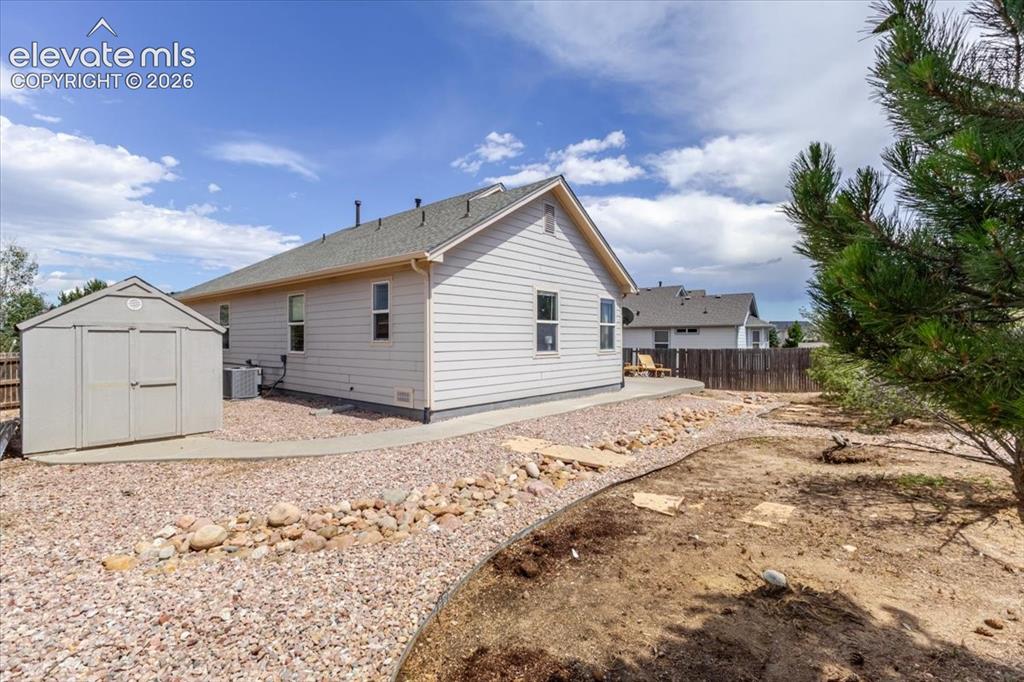 Image 30 of 38: backyard with storage shed