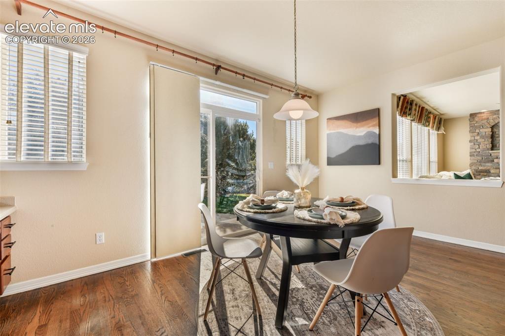 Image 15 of 50: Hardwood-style flooring throughout