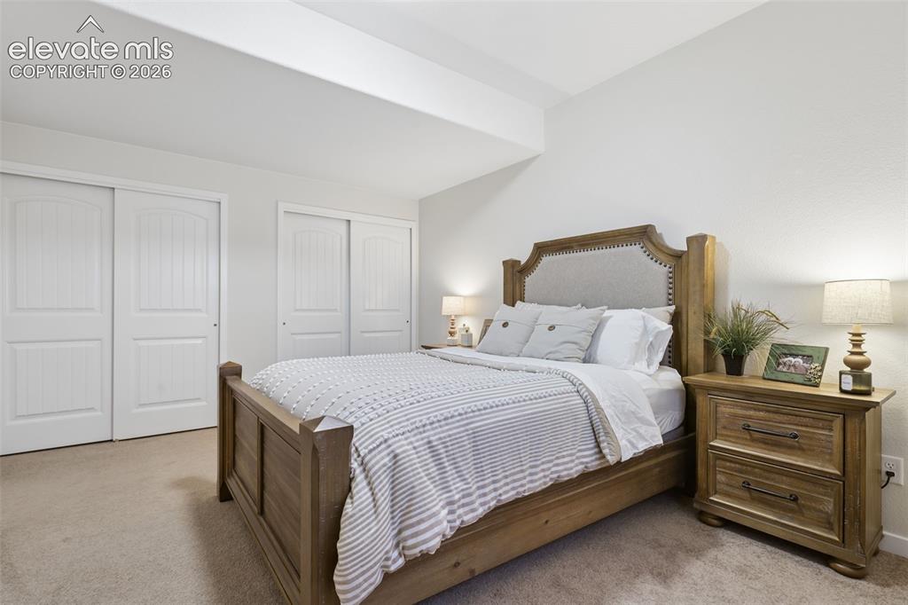 Image 42 of 50: Wall-to-wall carpeting and neutral wall tones