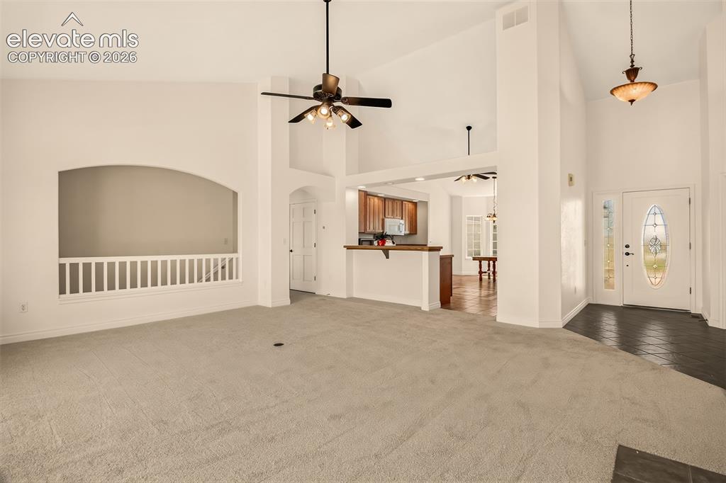 Image 14 of 50: Tile Entry To The Left, Great Room With Vaulted Ceilings Looking Into The K