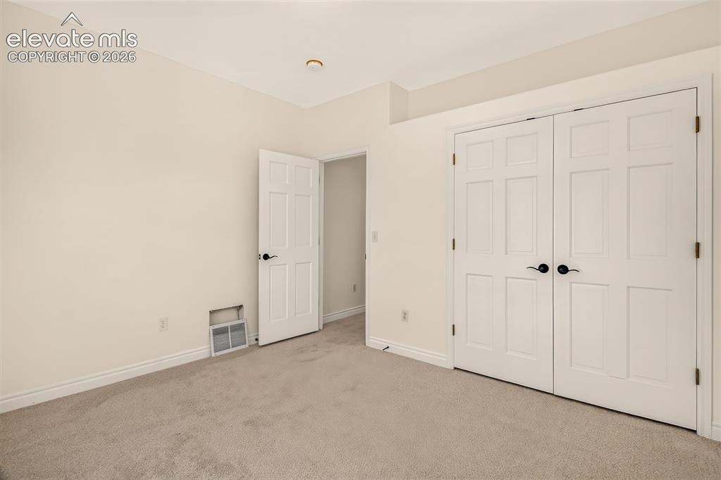 Image 18 of 50: Main Level Guest Bedroom