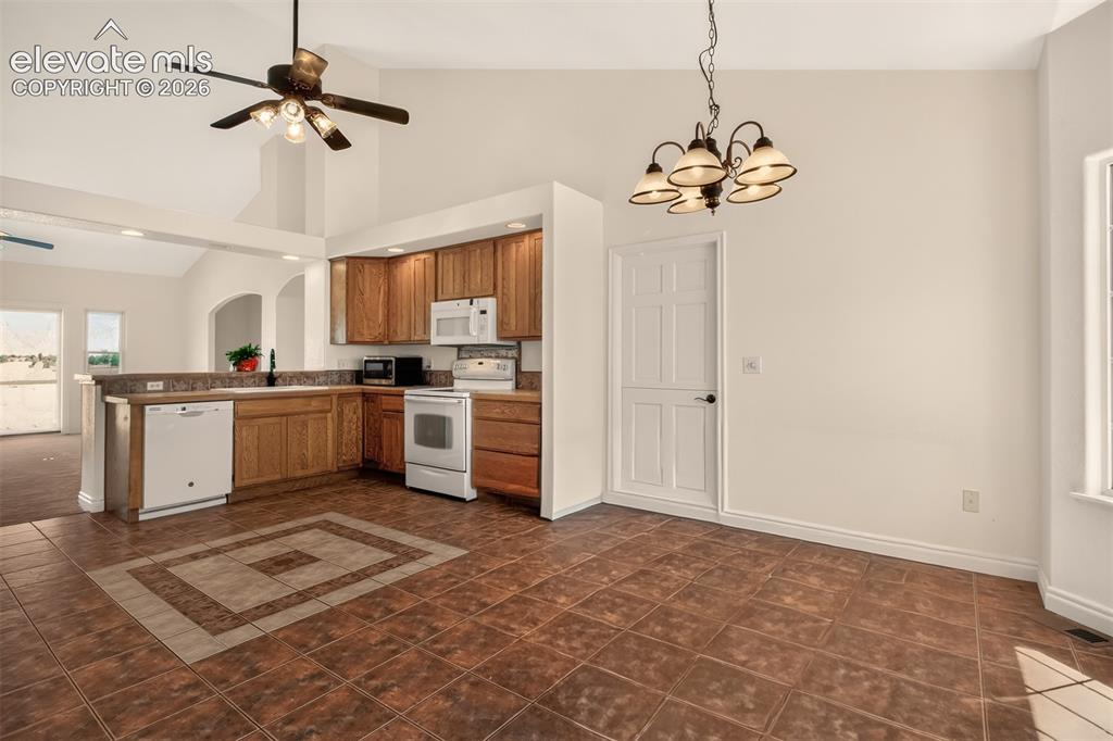 Image 19 of 50: Eat-In Country Kitchen With Tile Floor