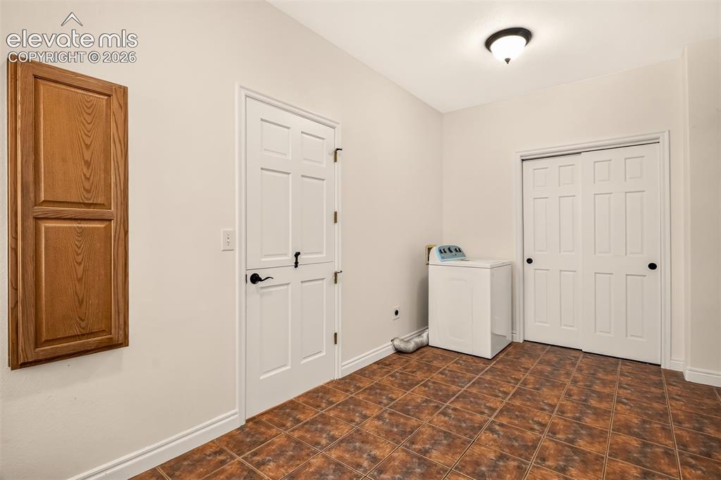 Image 22 of 50: Laundry With Closet, Walk-Thru To The Master Bedroom Or Kitchen