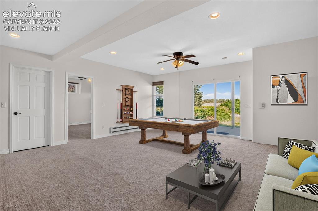 Image 38 of 50: Virtually Staged Photo of Basement Family Room