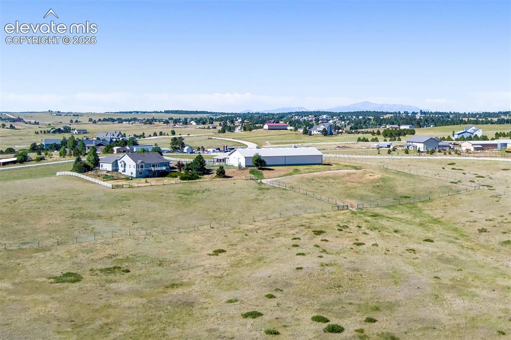 Image 49 of 50: Mountain Views In The Background, Middle Fence Across The Property, Back Fe