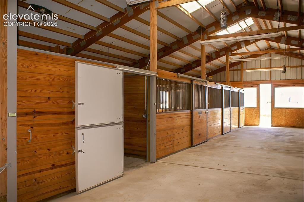 Image 5 of 50: Hay Storage And 3-Stalls, Exterior Sliding Doors In The Back