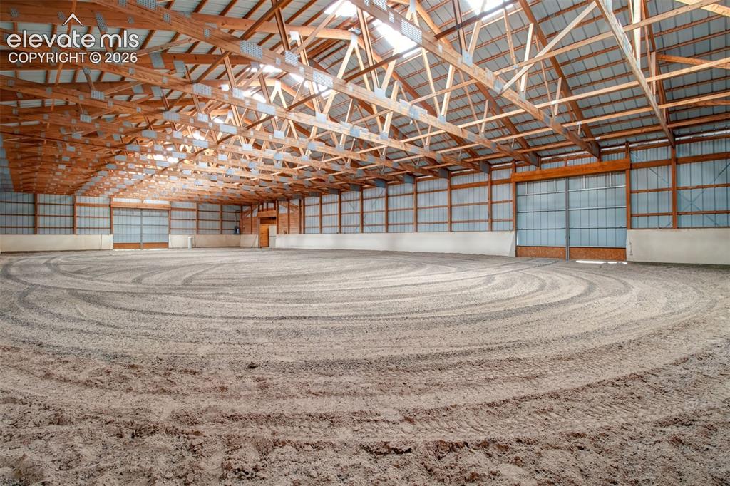 Image 8 of 50: Indoor Arena, Two Sliding Access Doors, Barn Entrance is at the far right c