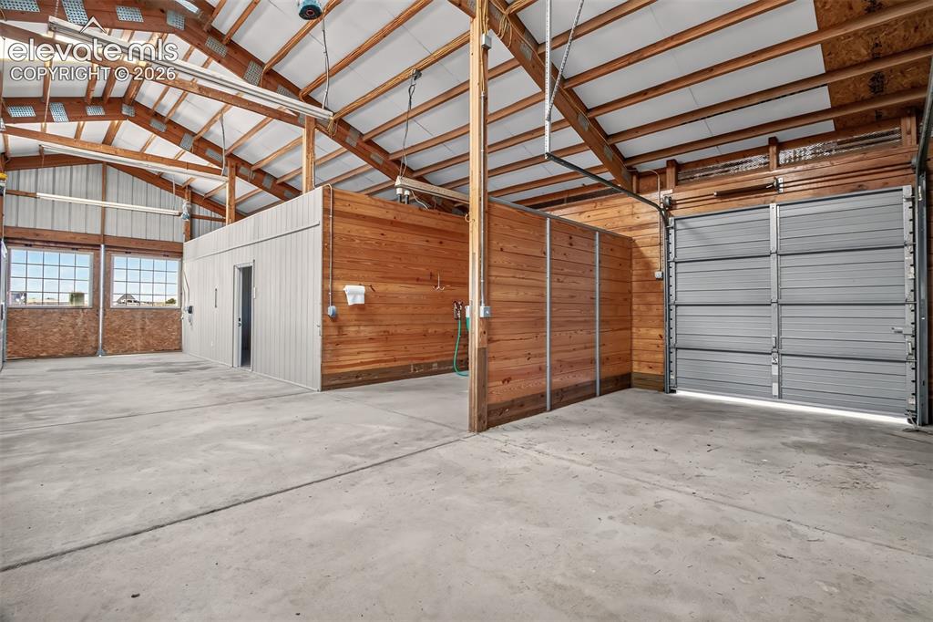 Image 9 of 50: Overhead Hay Delivery Door, Wash Bay, Caretakers Quarters
