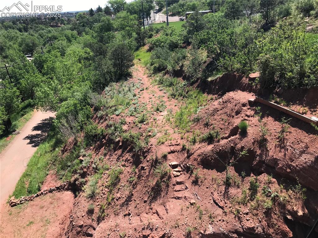 Image 4 of 5: Drone / aerial view featuring a wooded view