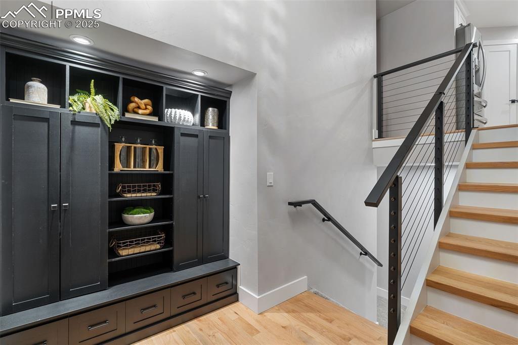 Image 23 of 48: Mudroom with light wood-style floors and recessed lighting