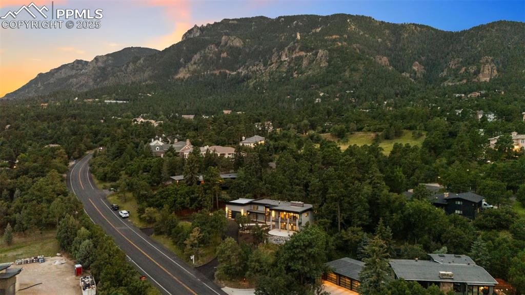 Image 42 of 48: Aerial view of property and surrounding area with mountains