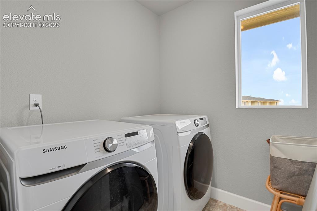 Image 16 of 28: Convenient upper level laundry room
