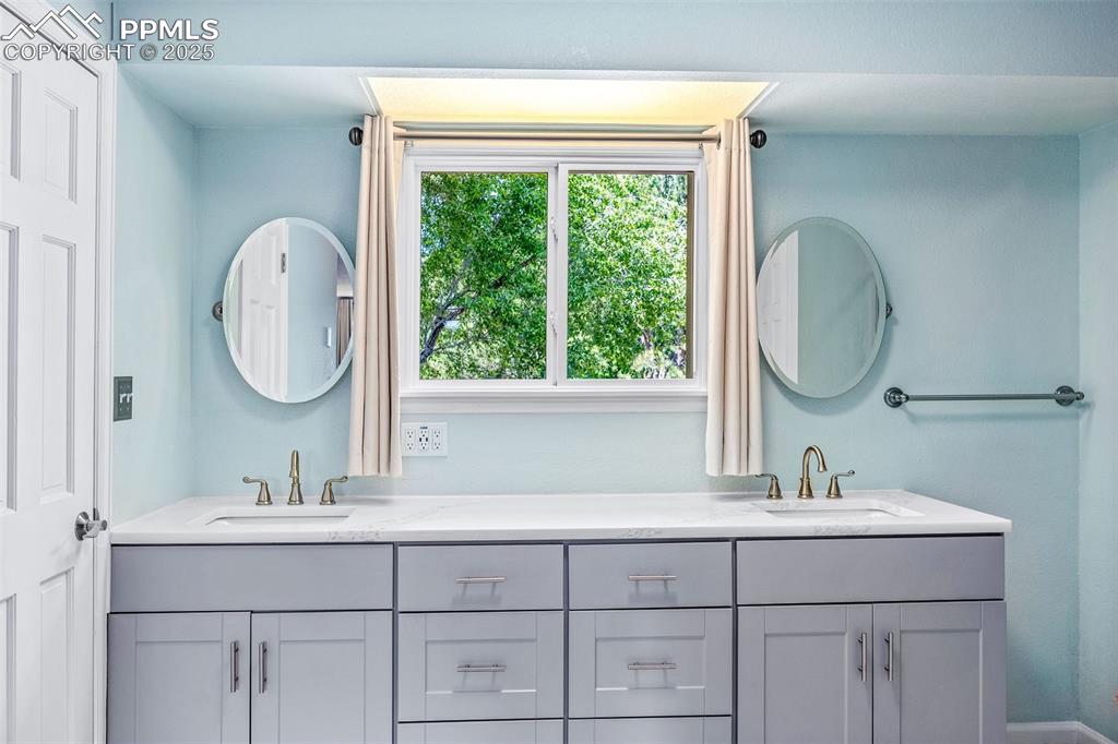 Image 16 of 47: Bathroom featuring double vanity