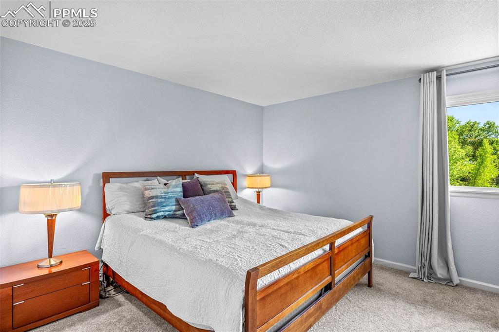 Image 18 of 47: Carpeted bedroom featuring baseboards